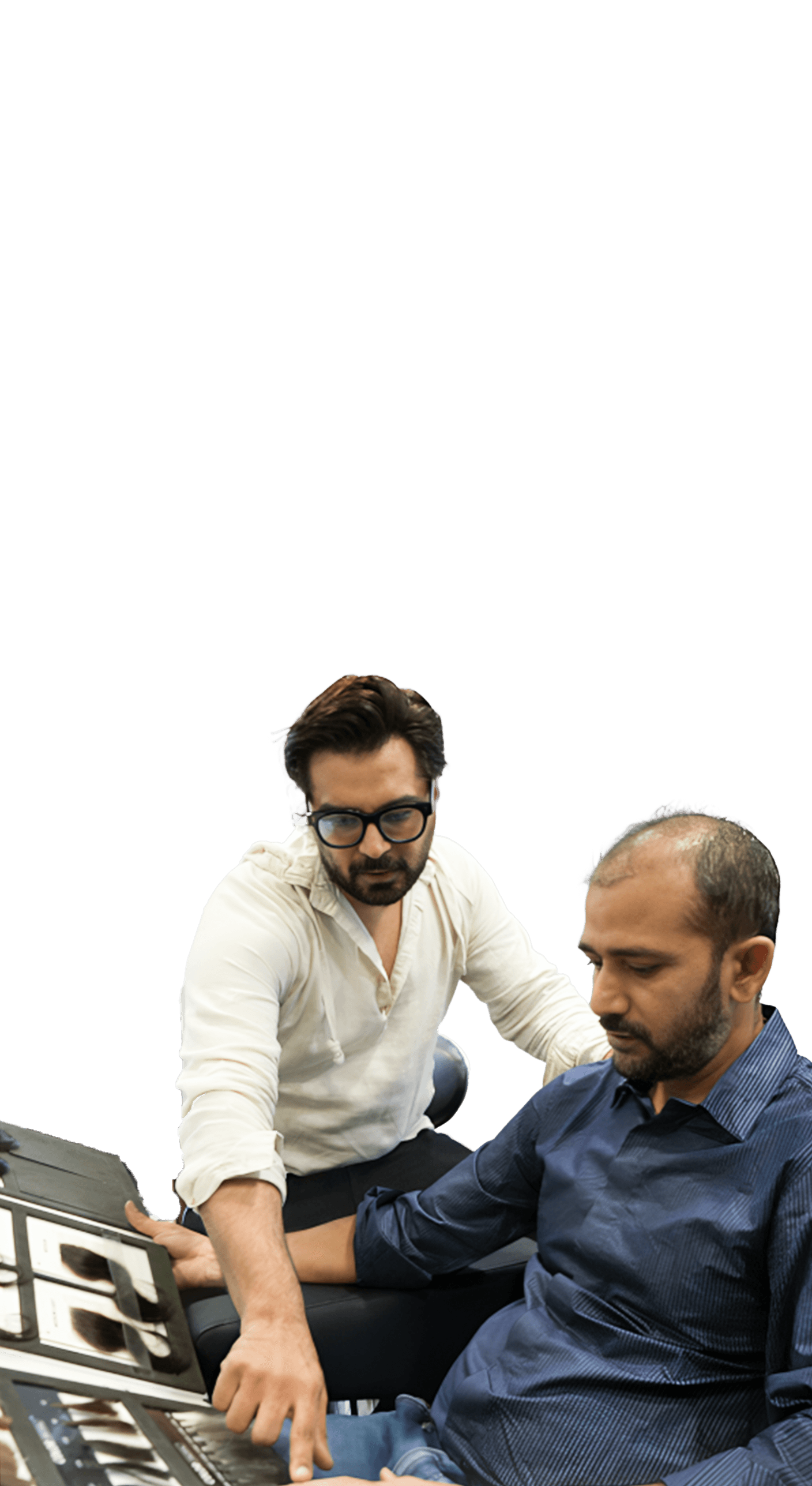 Mobile consultation step showing a specialist explaining hair system options to a client.