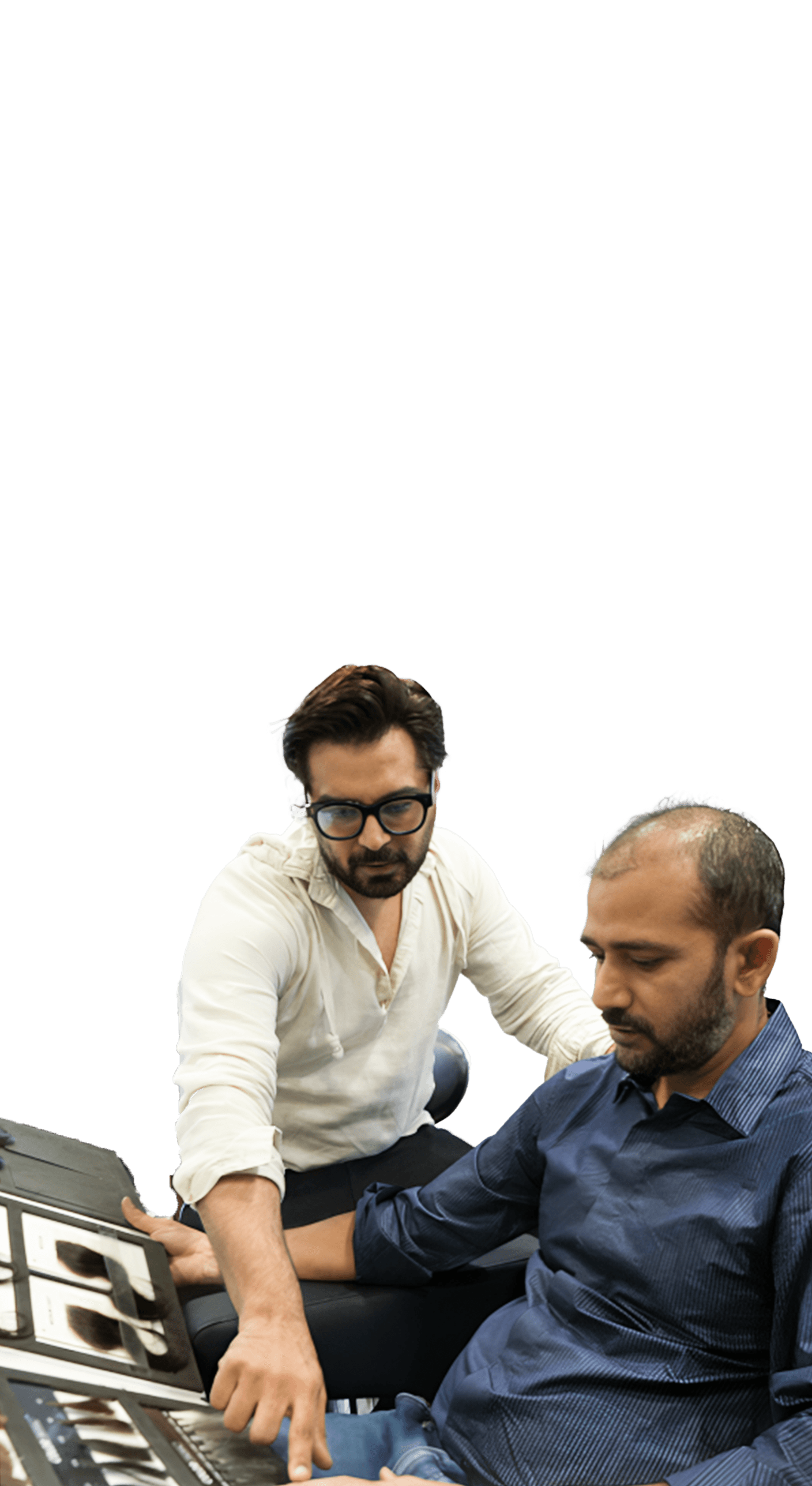 Consultation step showing a specialist explaining hair system options to a client.